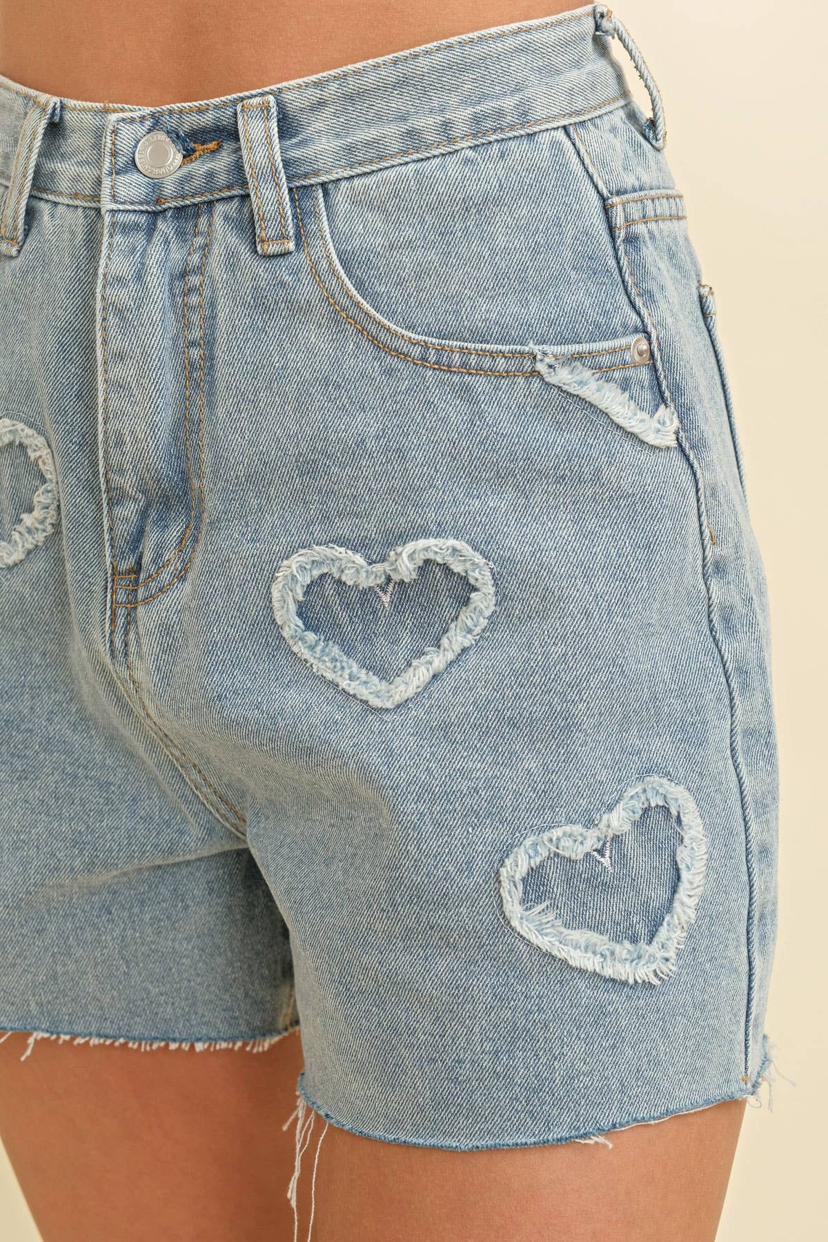 - HEART EMBROIDERED FRAYED DENIM SHORTS